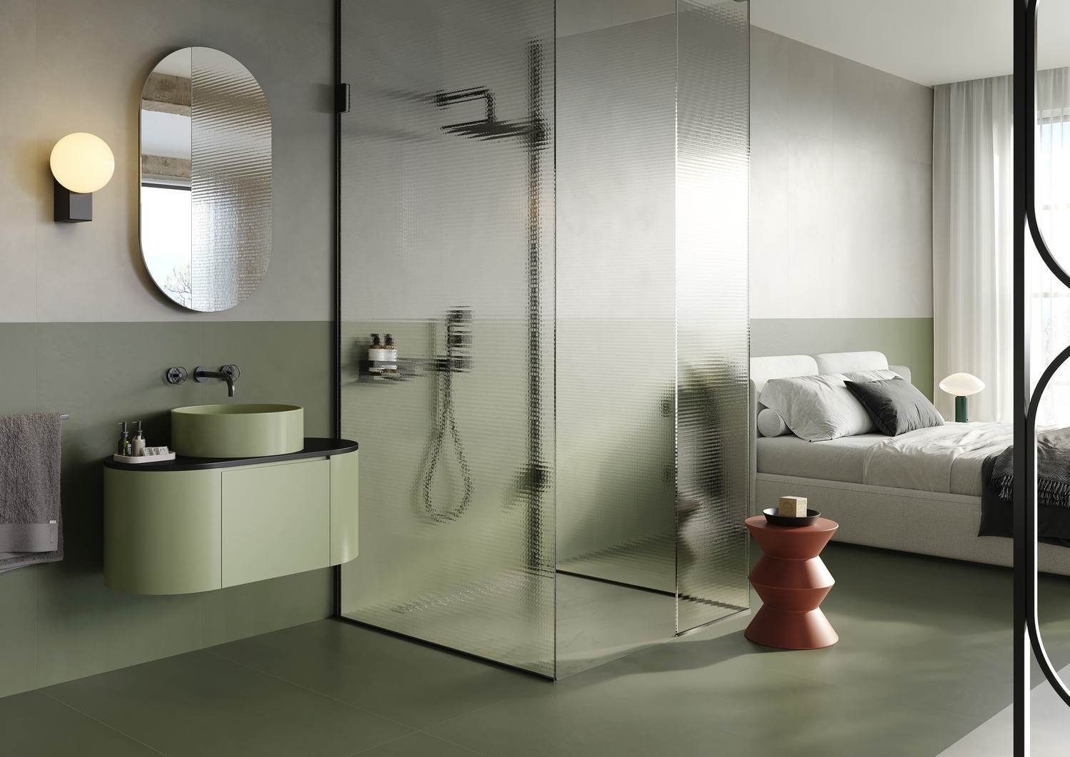 Minimalistyczna łazienka z zieloną umywalką i sypialnią. fot. Marazzi